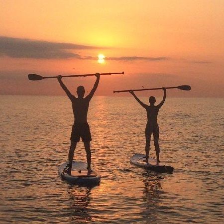 sunset paddle surf